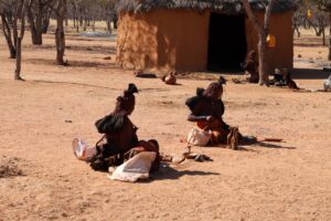 Himba Women sitting and crafting